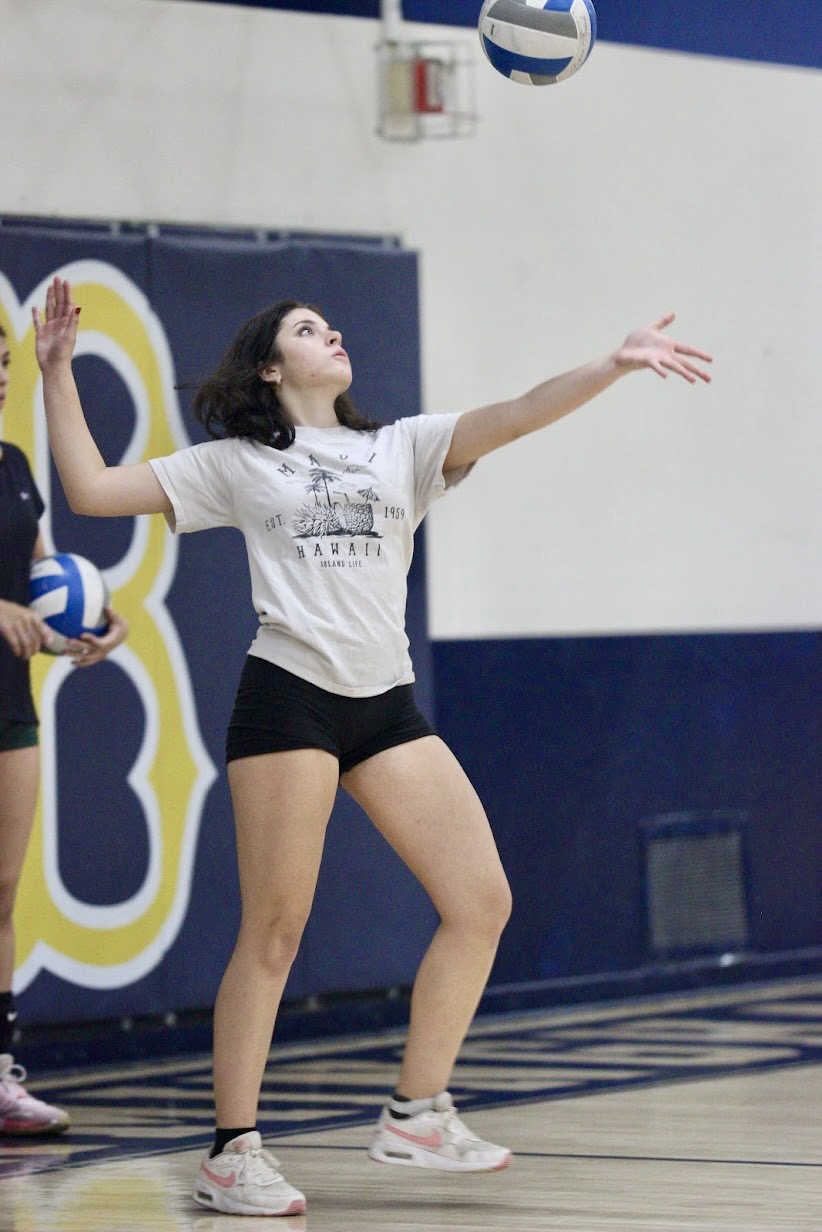 Junior varsity volleyball player Genevieve Gonzales serves the ball during after school practice at Birmingham Community Charter High School on Oct. 8. The JV girls volleyball team ended their season on Oct. 11 with a total of 11 wins and seven losses. 