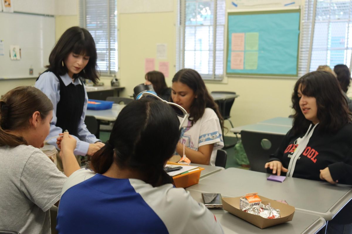 Sharks 4 Christ Club Vice President Genesis Cuellar-Figueroa engages with fellow club members during their meeting on Sept. 21.