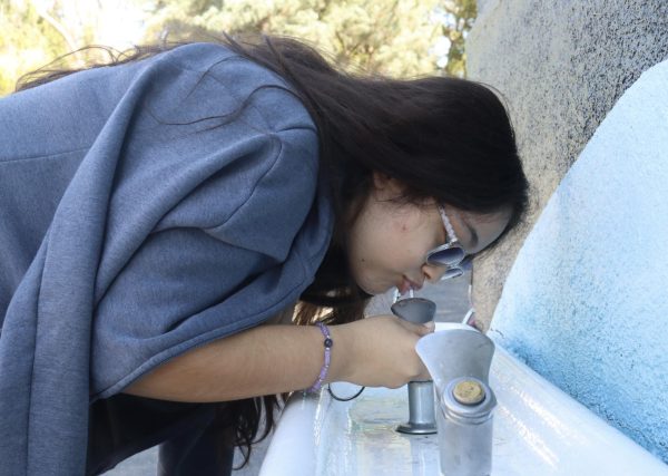 Sophomore Ariana Lopez-Villacorta drinks from a water fountain during the period 3 P.E. class on Oct. 3.
