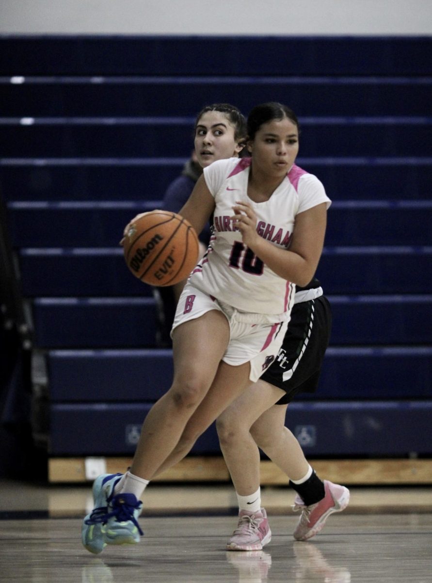 Freshman Ava Weinstein dribbles a basketball across the court during a JV girls basketball game at Birmingham Community Charter High School on Jan. 22. The game was against Granada Hills Charter High School and resulted in a victory of 63-34. 