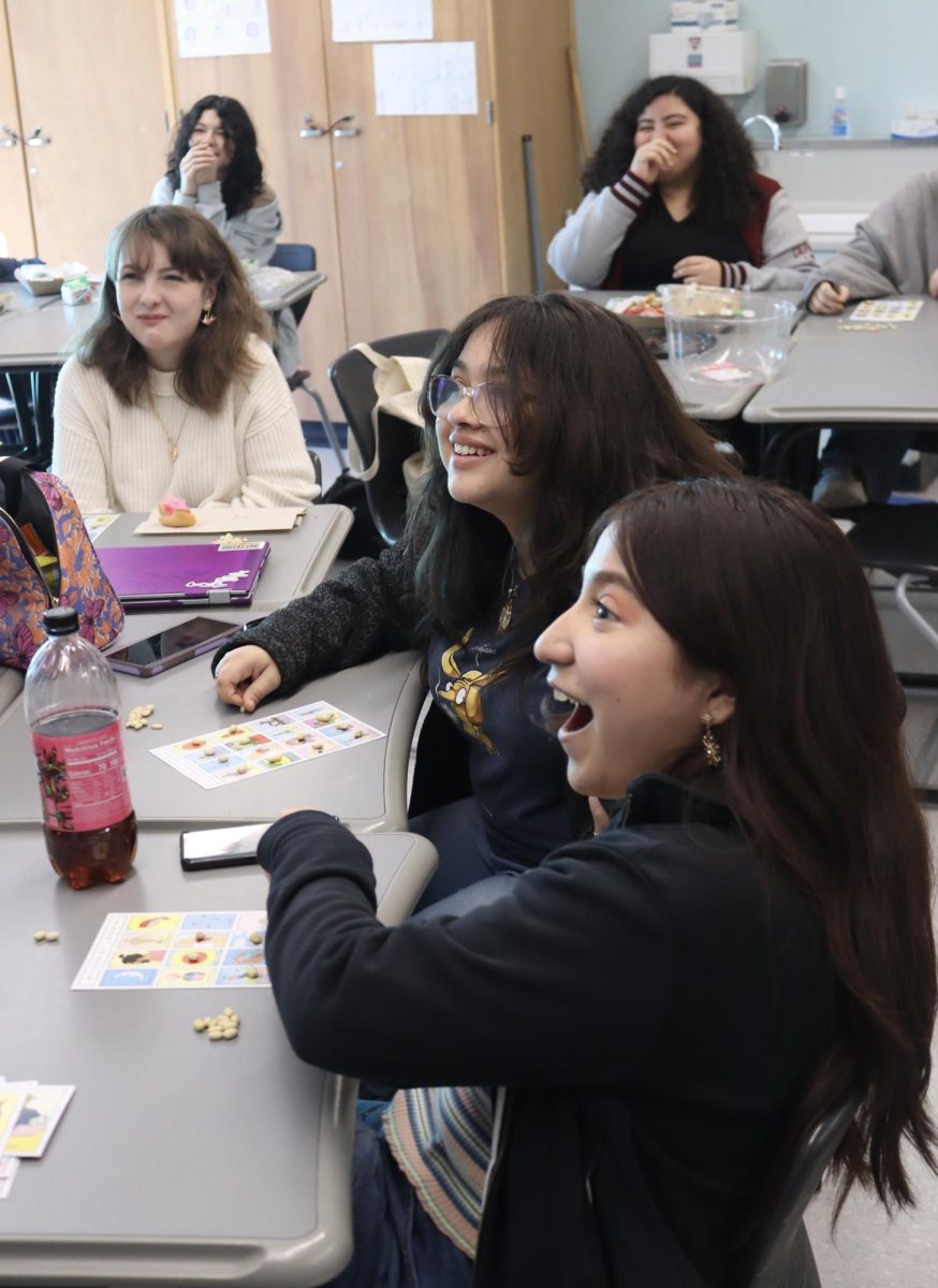 Sophomore Ariana Lopez and junior Vanessa Gonzalez play Lotería during a Hispanic Club lunch meeting on Jan. 25. 
