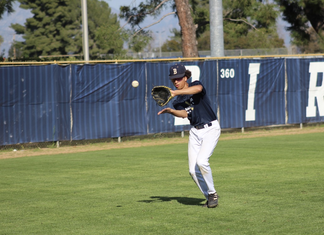 Freshman Bronson Jackson catches a baseball during practice at Birmingham Community Charter High School on Feb. 28. The varsity baseball team trained for their home non-conference game against Sylmar High School scheduled for Feb. 29.