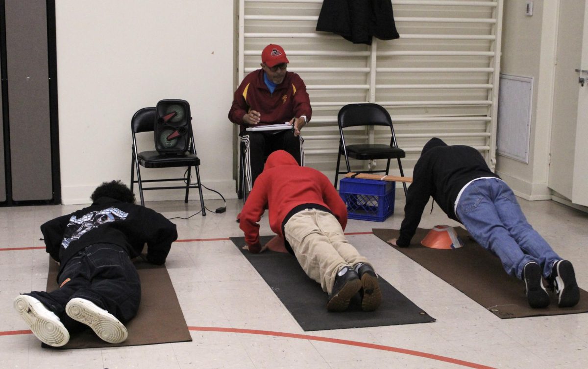 Students take the push-ups section of the FitnessGram in the MPR on Feb 5. Due to inclement weather, only about one third of the class 31 students were present.