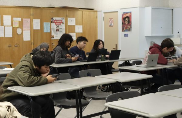 Seniors talk to one another in their period 1 AP English Language class on Feb. 5. Los Angeles Unified School District campuses remained open on Monday despite a rain storm that began during the weekend. A total of 116 students, about half of the student body, attended school on Feb. 5.