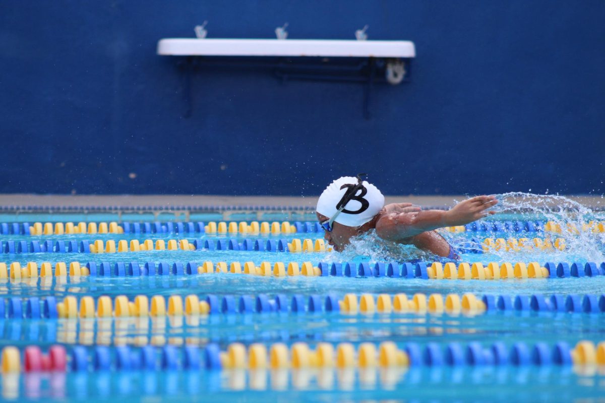 Sophomore Kaleigh Tapaoan glides through the water during a swim competition at Birmingham Community Charter High School on March 18. It is Tapaoans first year on the varsity girls swim team and she is excited for what is to come this season.