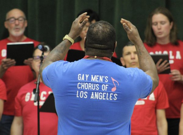 Conductor Ernest H. Harrison conducts the Gay Men’s Chorus of Los Angeles to sing “True Colors” by Cyndi Lauper on April 12. In the MPR during period 4, the chorus sang, danced and had interactive activities for the audience. 