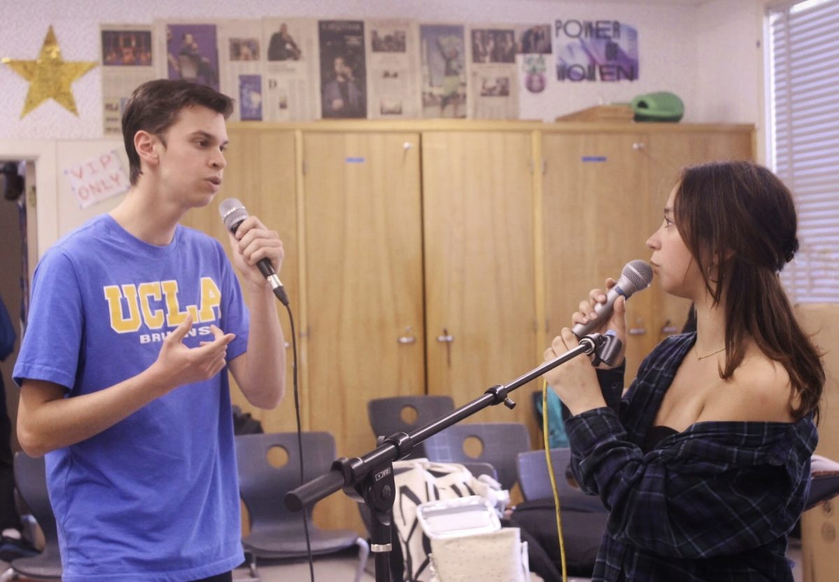 Seniors Alan Ruiz and Alejandra Iniguez rehearse the song “Night Changes” by One Direction on April 16 for the April 23 Spring Serenade concert.