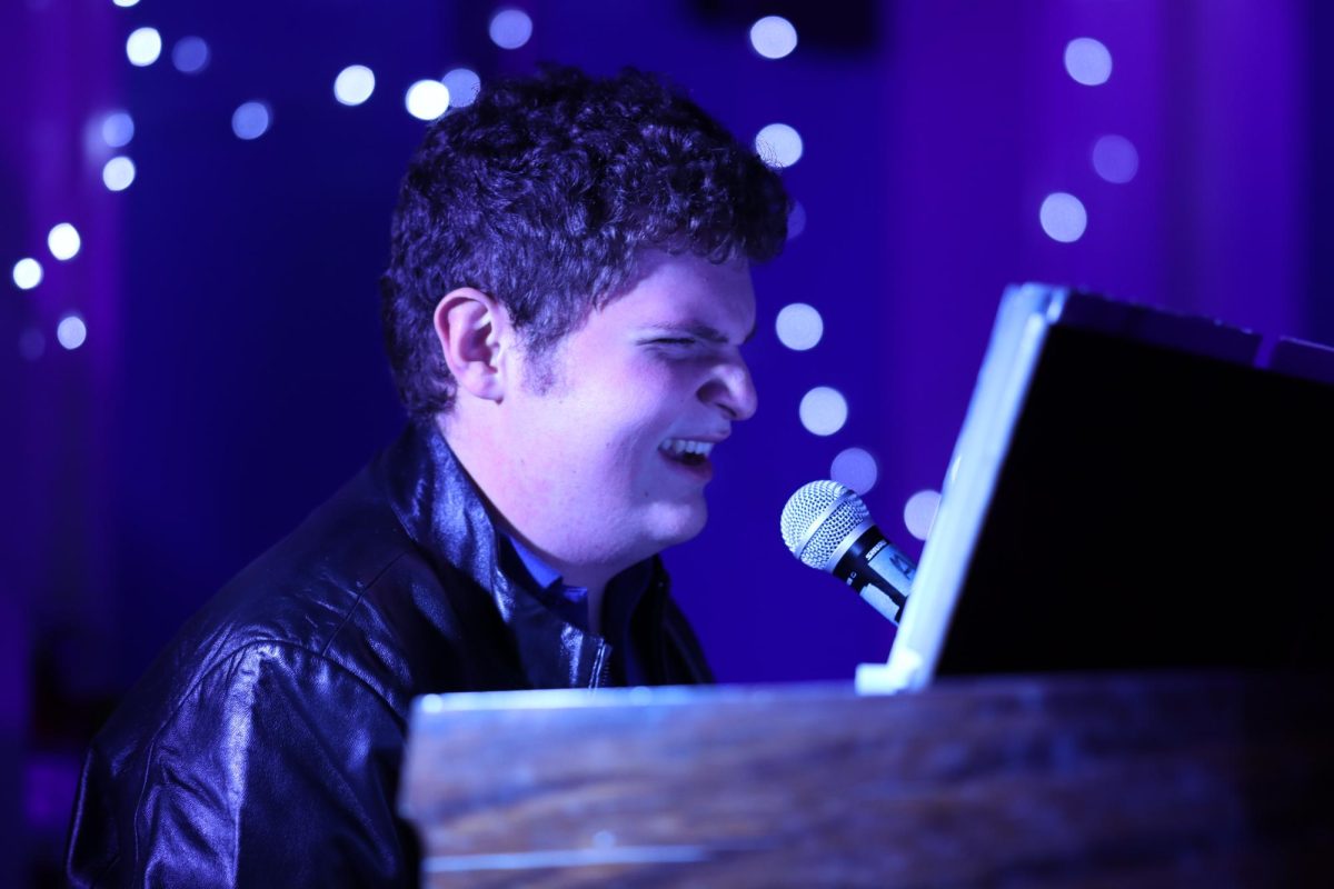 Junior Matthew Bersudsky sings "Rocket Man" by Elton John during the World Music Day performance on Oct. 30.
