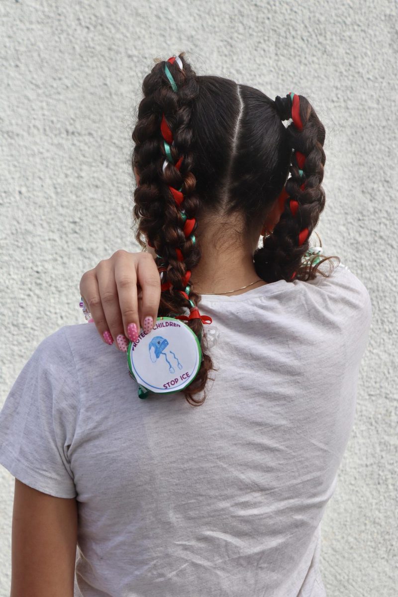 Freshman Niya Bowers displays her handmade pin depicting 5-year-old Liam Ramos, who was detained by Immigration and Customs Enforcement (ICE) on Jan. 20. 