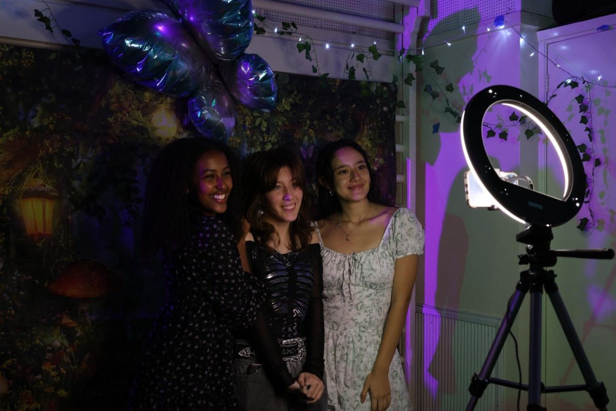 Freshmen Bethania Terefe, Juliana Rodriguez and Jennika Vicents pose for a picture at the Enchanted Garden Dance on Jan. 30. Other than socializing and dancing, students had the opportunity to take pictures and selfies at the photo booth during the dance.