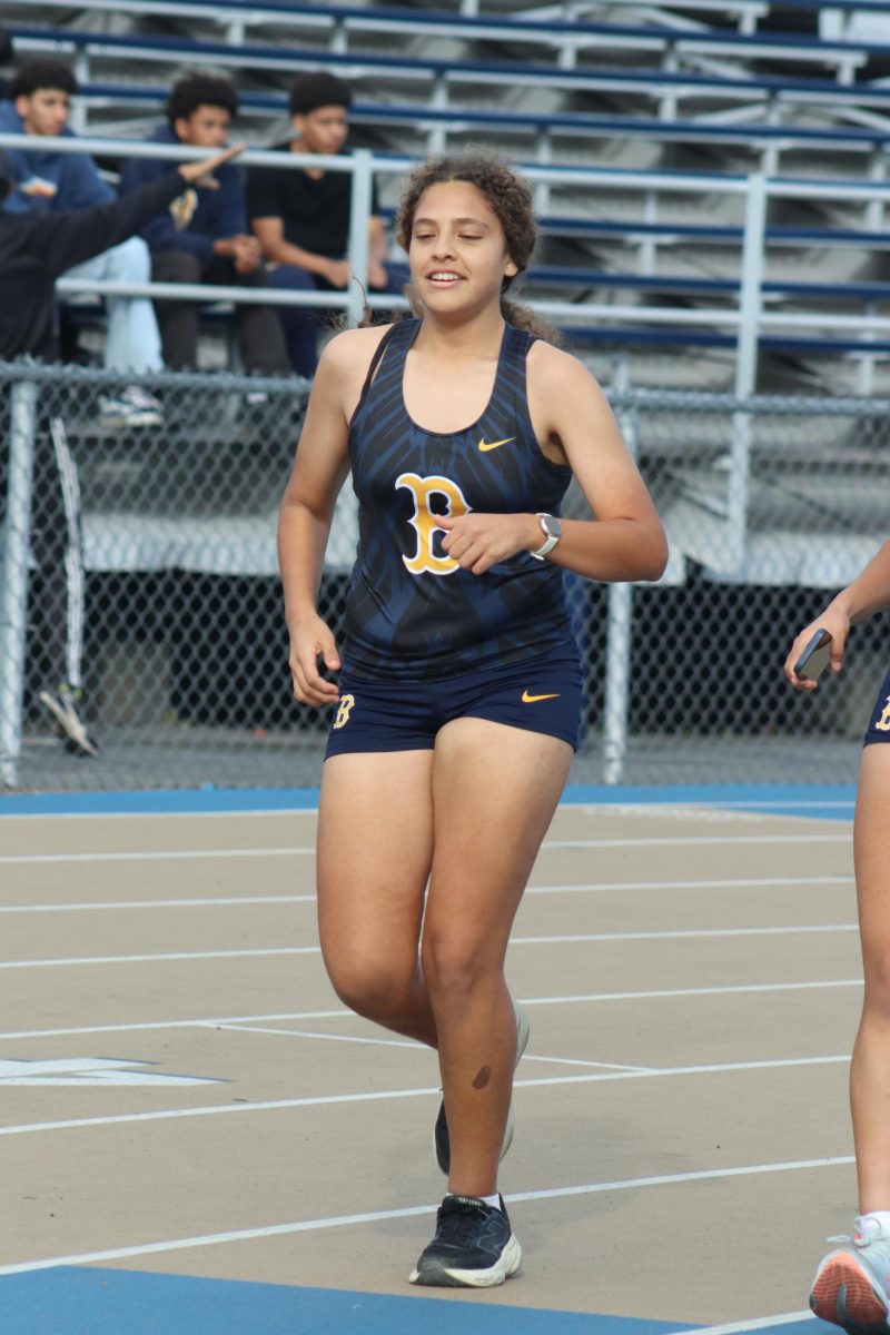Freshman Camila Serrano runs on the track during practice at Birmingham Community Charter High School on Feb. 13.