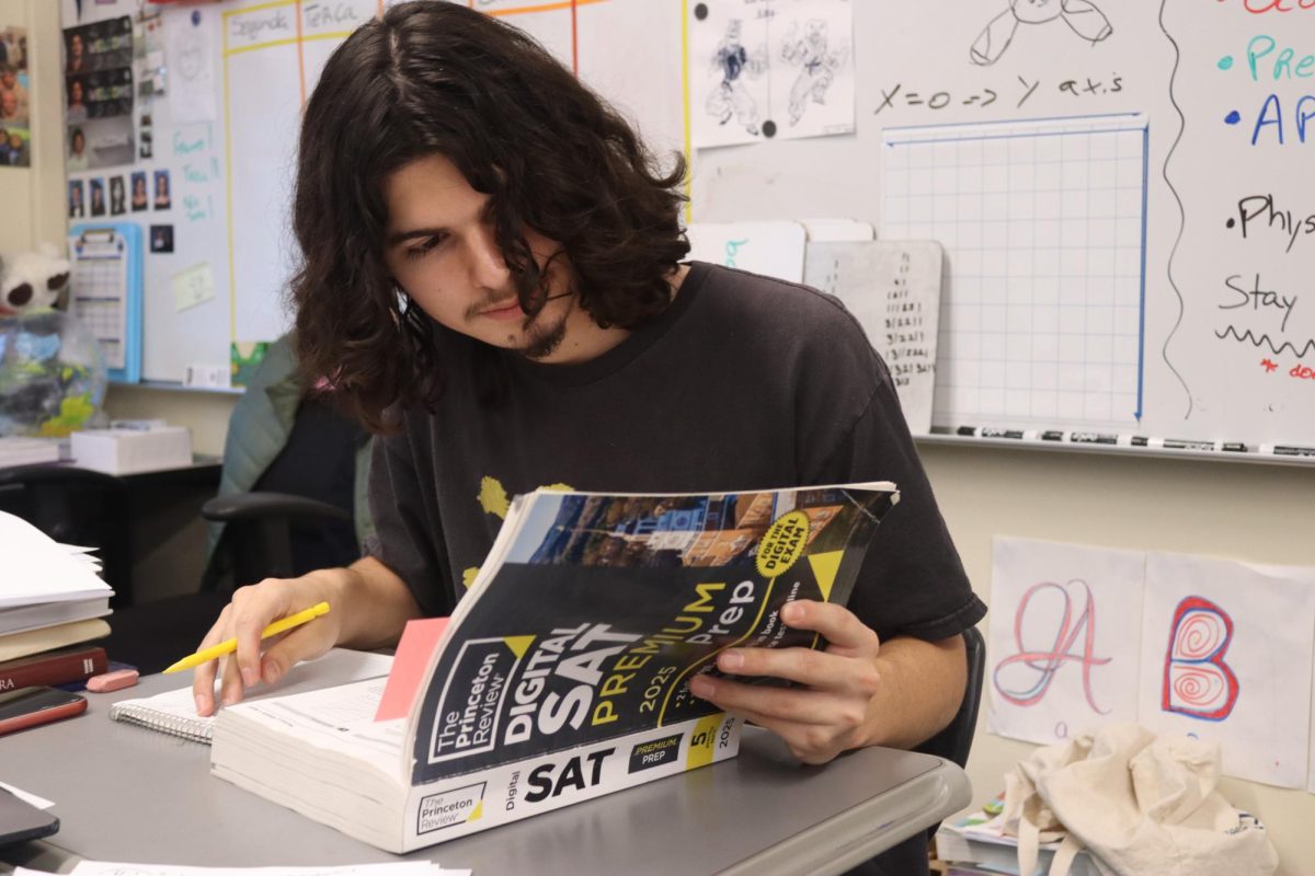 Junior Mateo Zazueta studies for the SAT during the Keep Youth Doing Something study hall program on Dec. 3.