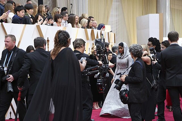 Janelle Monae walks the red carpet at the Oscars. During the event several celebrities provided shoutouts to troops.