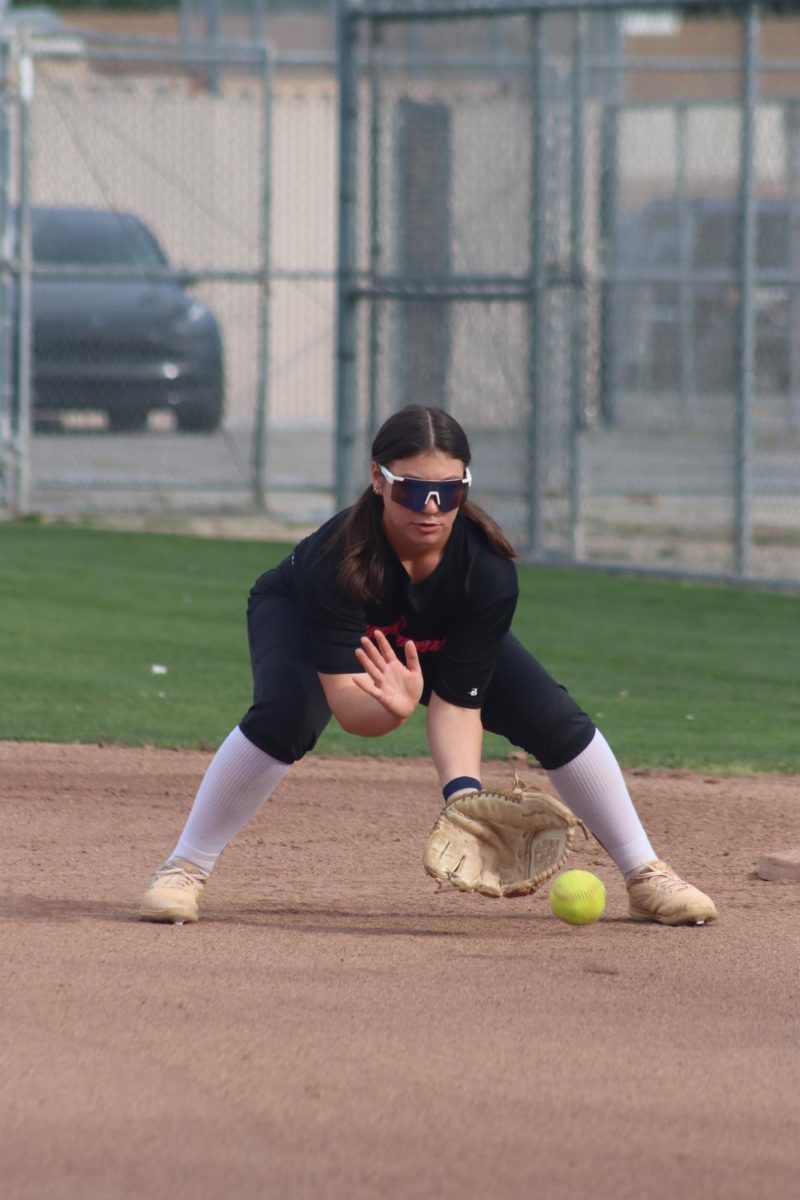 Junior Emma Bullock catches the ball during practice at Birmingham Community Charter High School on Mar. 25. This is her third year playing varsity softball. 