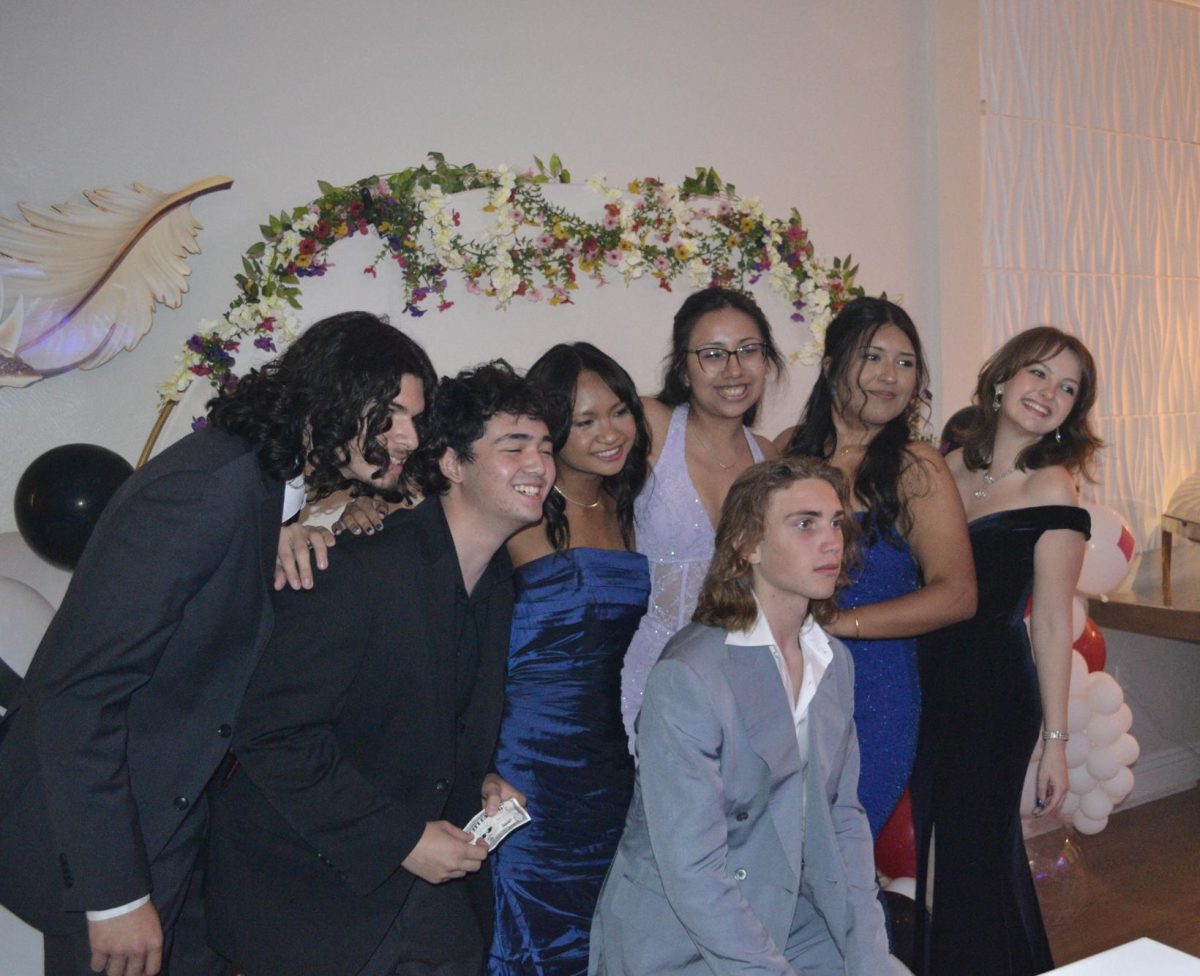 Students enjoy the photobooth at prom on May 16.