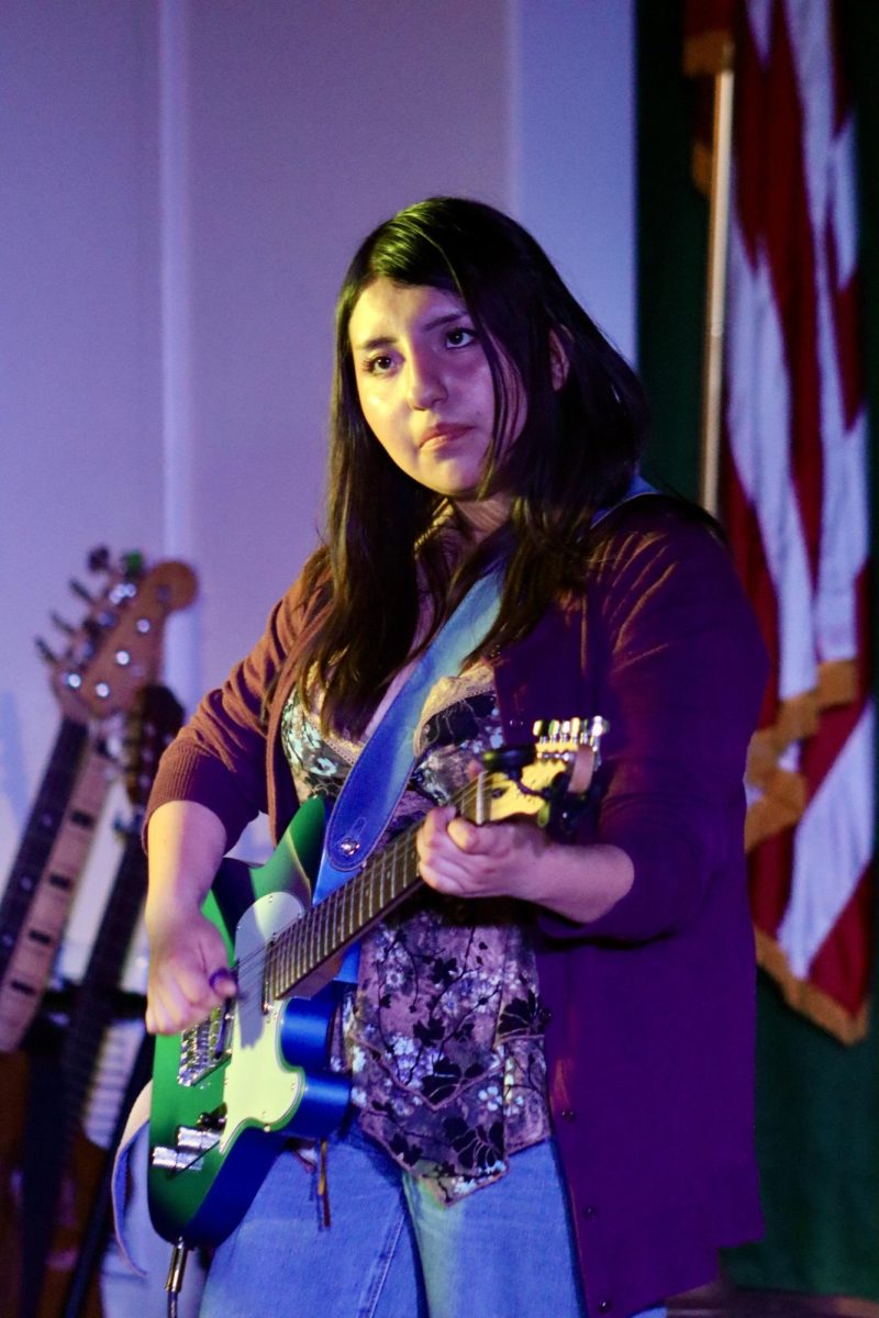 Junior Kismet Oropeza Sanchez plays the guitar on "Dark to Light" by Louis Tomlinson during the Spring Concert on May 19.