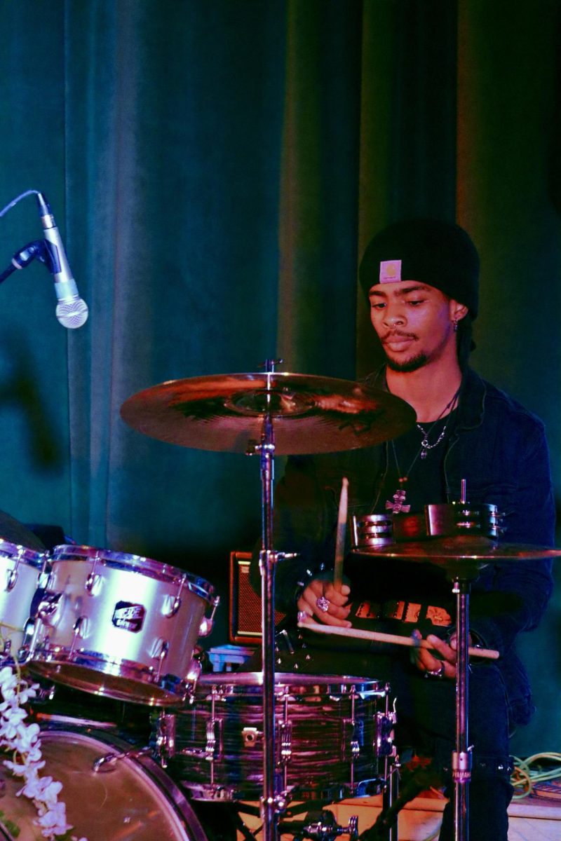 Senior Tyson Hansen plays the drums for "Back to Black" by Amy Winehouse during the Spring Concert on May 19.