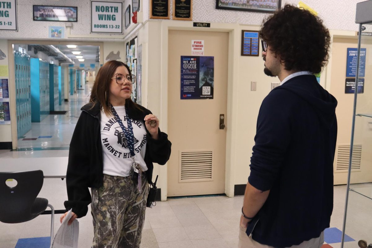 Principal Kimberly Figueroa-Oliveira speaks to math teacher Gonçalo Fino De Sousa on May 15 about i-Ready math and English diagnostic tests.