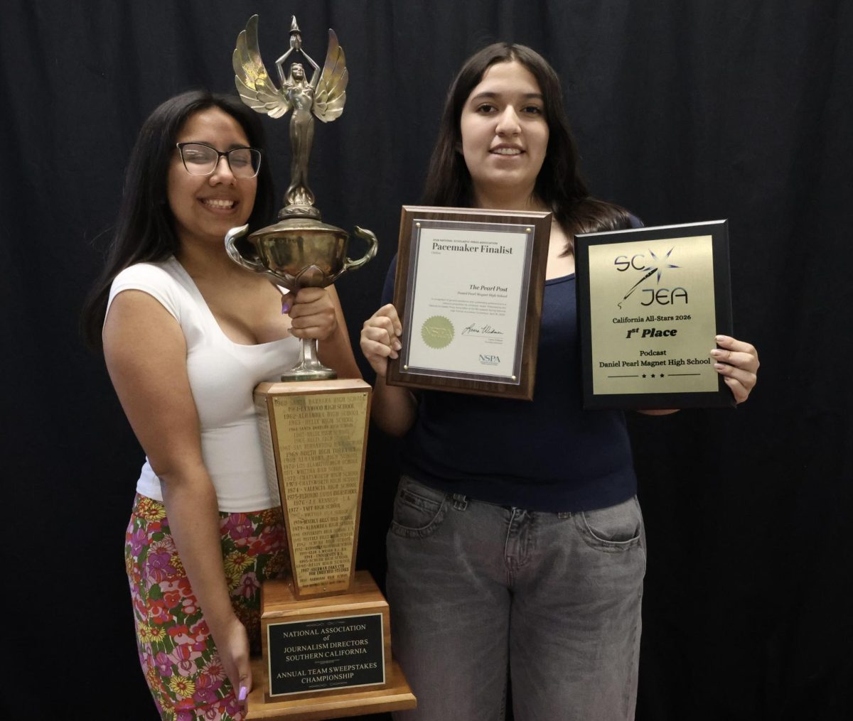 Print and Online Editor-In-Chiefs Jenny Marquez and Tania Lopez hold awards that DPMHS Student Media have won this
school year, including the Newspaper Sweepstakes, pacemaker finalist and California All-stars first place plaque for the Room
22 podcast.