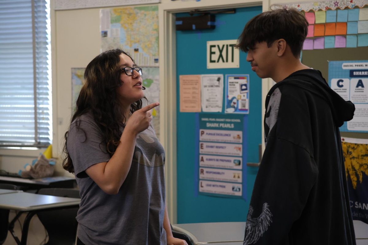Junior Midori Lestrange and senior Jacob Ruiz participate in a Community Building Circle activity on May 19.
