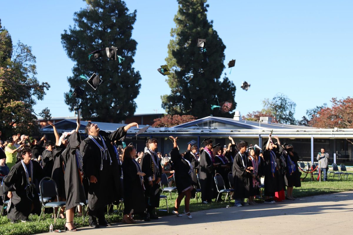 The class of 2026 throw their caps in the air at the end of their graduation ceremony on June 10.