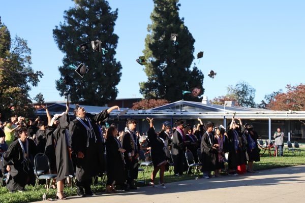 The class of 2026 throw their caps in the air at the end of their graduation ceremony on June 10.